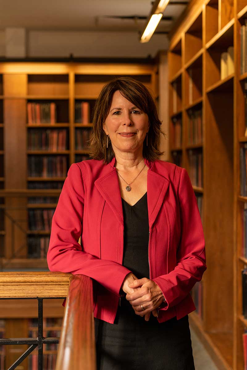 Headshot of woman standing in library